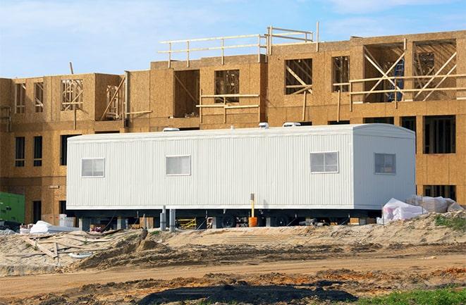 crane lifting modular building for construction office rentals in Granada Hills